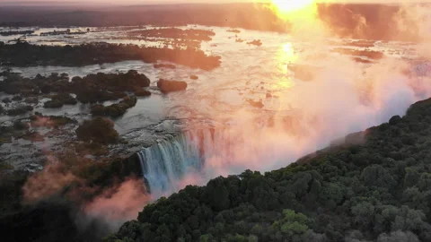 Sunrise at Victoria Waterfall in Zimbabwe, stunning colorful aerial in Africa Stock Footage