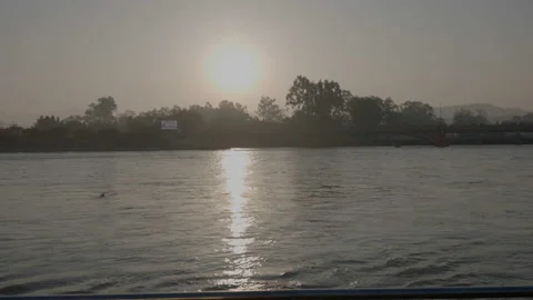 Sunrise view along with river Ganges ,Holy Ganga, at Maha Kumbh Haridwar Stock Footage 153475520