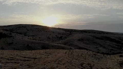 Sunrise view from behind the mountains Stock Footage 144976516