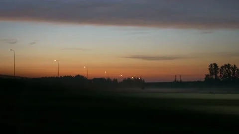 Sunrise view from a car driving on highway Stock Footage 170611048