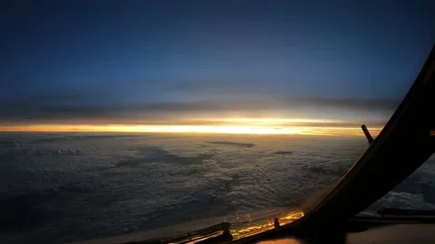 Sunrise view from cockpit while flying Stock Footage 229365982