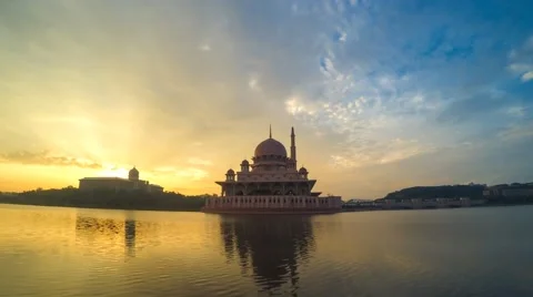Sunrise view of Mosque across lake reflection Stock Footage