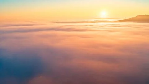 Sunrise view over the low clouds in the high Andean mountains Stock Photos