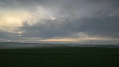 Sunrise with a view of wind turbines Stock Footage 152237122