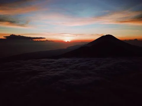The Sunrise On The Volcano Batur On The Island Of Bali In Indonesia Stock Photos