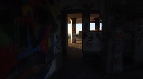 Sunrise walking inside an abandoned building with paintings and graffiti gimbal Stock Footage 67355614