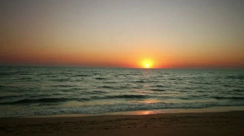 Sunrise with wave on beach Stock Footage 8799032