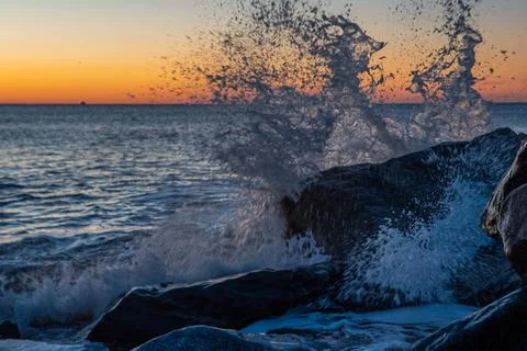 Sunrise wave splash Stock Photos