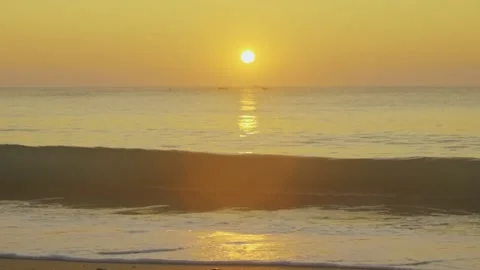 The sunrise with waves breaking in slow motion Stock Footage 286103573