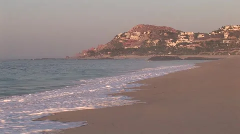 Sunrise Waves Roll Onto Empty Beach Stock-Footage 1012690