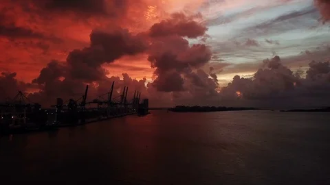 Sunrise Where The Sky Turned Red. Over Looking Miami Loading Cranes Video stock 82587513