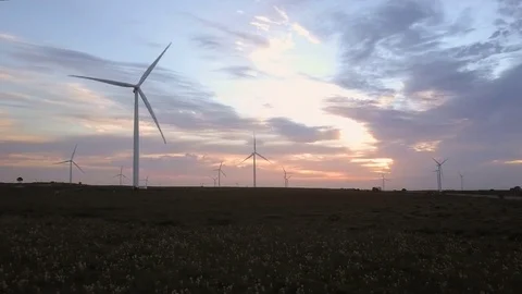 Sunrise with wind farm propellers Stock Footage 71613483