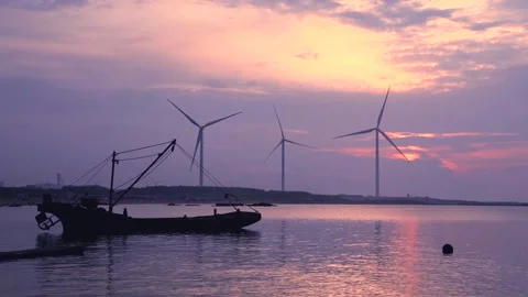 Sunrise wind power windmill on the coast of China Stock Footage 133481318
