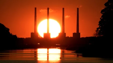 Sunrises behind smoke stacks. Stock Footage 95600724