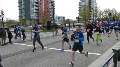 Sunrun April 2017 Vancouver marathon runners Stock Footage 77481174