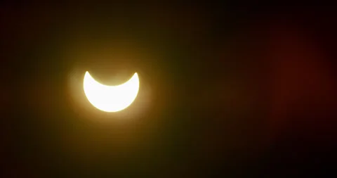 Sun’s crescent takes shape during the solar eclipse of August 21, 2017. Stock Footage 285977360