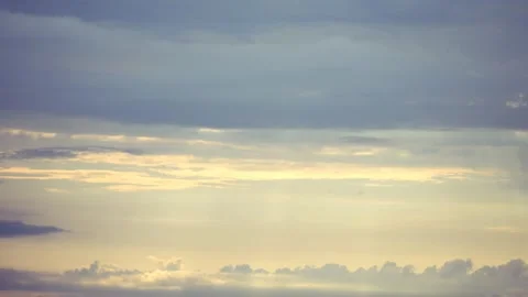 The sun's rays break through the clouds. Sunbeams between cirrus clouds. Stock Footage 308411339