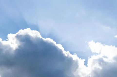 The sun's rays come out of the clouds. Stock Photos