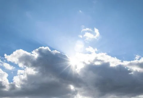 The sun's rays come out of the clouds. Stock Photos