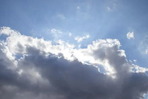 The sun's rays come out of the clouds. Stock Photos