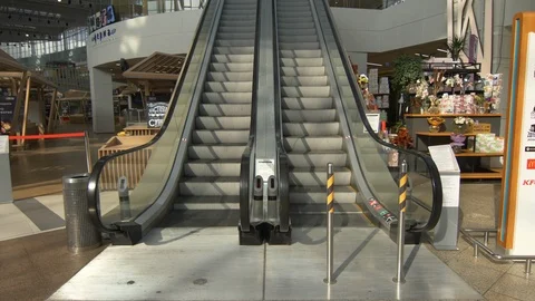 Sun's Rays Hit the Escalator Stock Footage 123495715