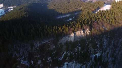 The sun's rays illuminate the rocks in the spruce mountain Stock Footage 171992518