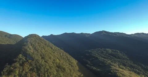The sun's rays lying on the high mountains Stock Photos