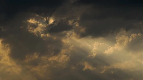 The sun's rays make their way through the clouds. Time lapse Stock Footage 105855016