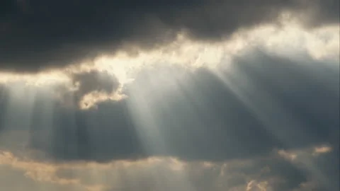 The sun's rays make their way through the clouds. Time lapse Stock Footage 105855454