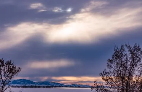 The sun's rays make their way through the dark clouds, Altai, Russia Stock Photos