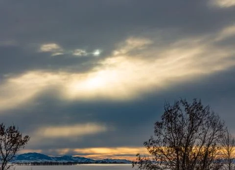 The sun's rays make their way through the dark clouds, Altai, Russia Stock Photos