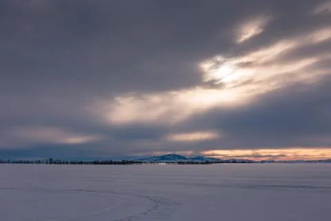 The sun's rays make their way through the dark clouds, Altai, Russia Stock Photos