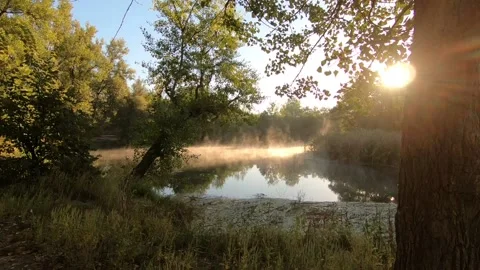 The sun's rays over the floating water. Stock-Footage 140095415