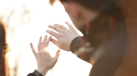 The sun's rays pass through the hands Stock Footage 48484363
