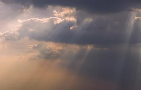 The sun's rays passing through the clouds and shining. Stock Photos