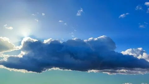 The sun's rays pierce through the clouds, creating a stunning display of li.. Stock Photos