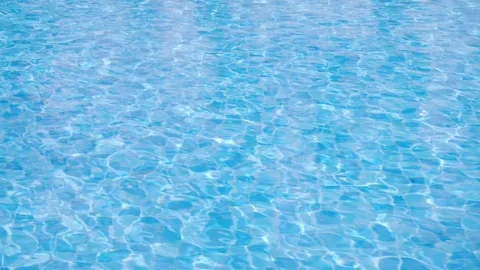 The sun's rays play in the clear water of the blue pool. Stock Footage 118597723