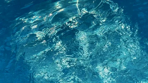 Sun's rays play on the water in the pool Video stock 325451421