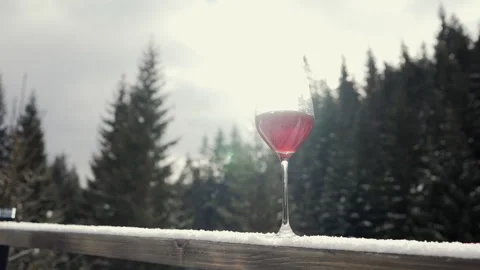 The sun's rays shine into a glass of red wine. Stock-Footage 265174503
