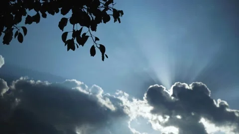 The sun's rays shine through the clouds Stock Footage 240229312