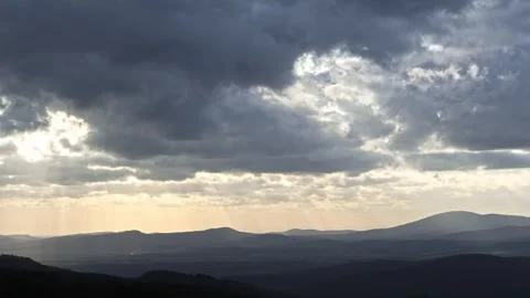 The sun's rays shine through the moving clouds 스톡 동영상 271185556