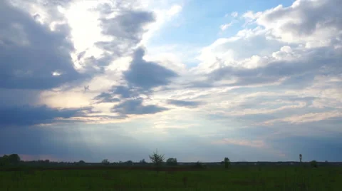 The sun's rays shines through the clouds. Timelapse in nature. Stock Footage 37396290
