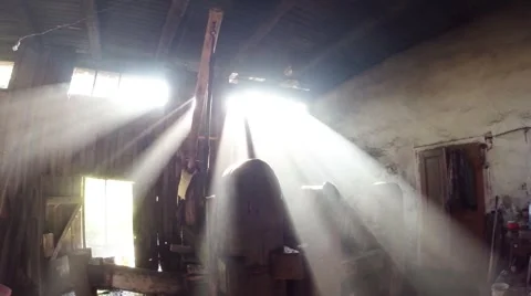 The sun's rays in the smoke of the old smithy hammer visible Stock Footage 46421261