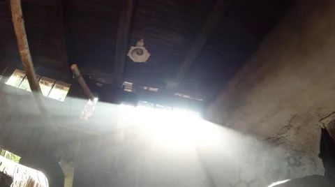 The sun's rays in the smoke of the old smithy, visible wooden ceiling Stockbeeldmateriaal 46421422