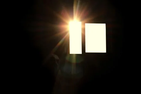The sun's rays in the window in a dark room Stock Photos