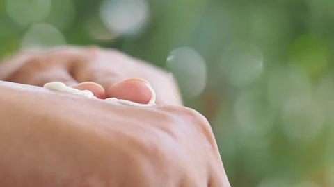 Sunscreen application for healthy skin in sun light Video stock 321787262