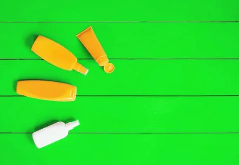 Sunscreen on a blue background. Selective focus. Stock Photos