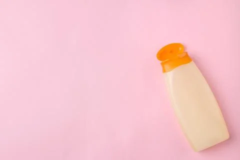 Sunscreen on a bright pink background. summer. vacation. top view. space for Stock Photos
