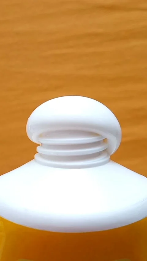 Sunscreen Cream Texture Squeezed From Tube on Yellow Background Stock Footage 327900106