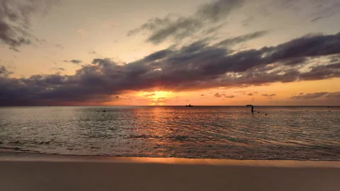 Sunset on 7 mile beach in cayman islands in slo motion 動画素材 268532100